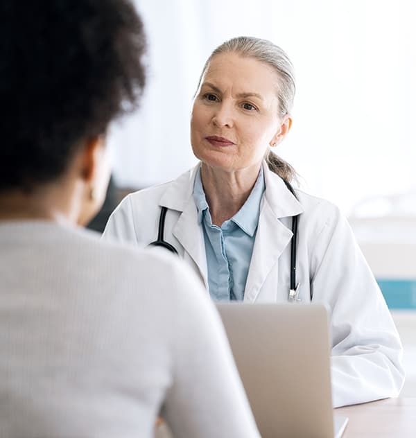 Rainier OB/GYN provider doctor medical consultation with patient discussing surgery